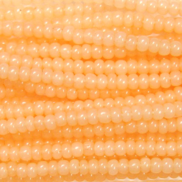 8/0 Czech Seed Bead, Waxy Apricot Opal Tint**