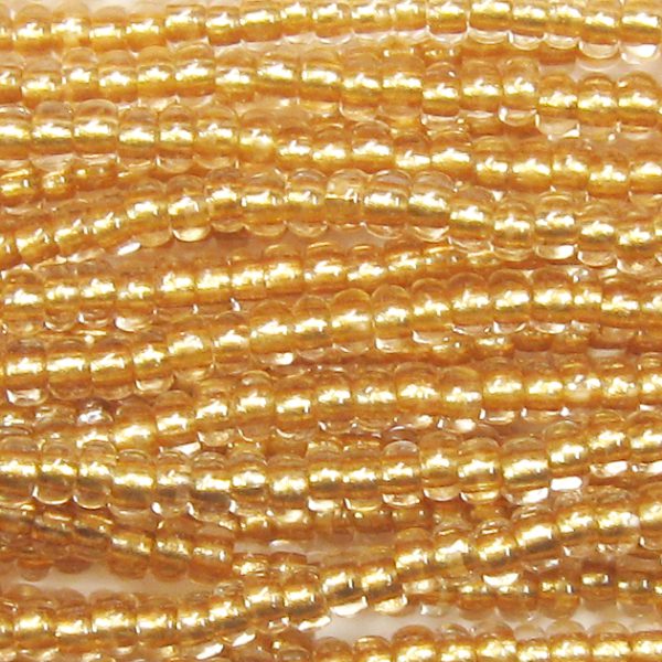 6/0 Czech Seed Bead, Metallic Gold Tint Lined Crystal
