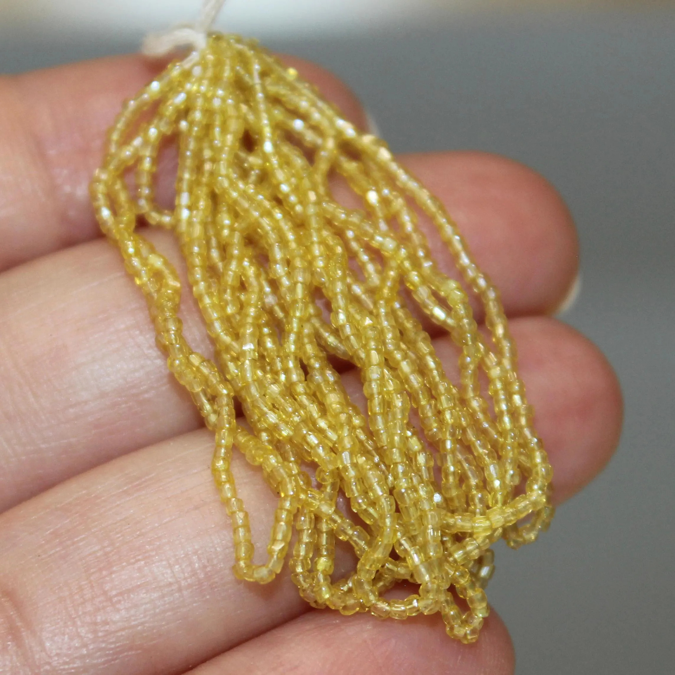 16/0 Vintage Micro Three Cut Transparent Jonquil Luster hank