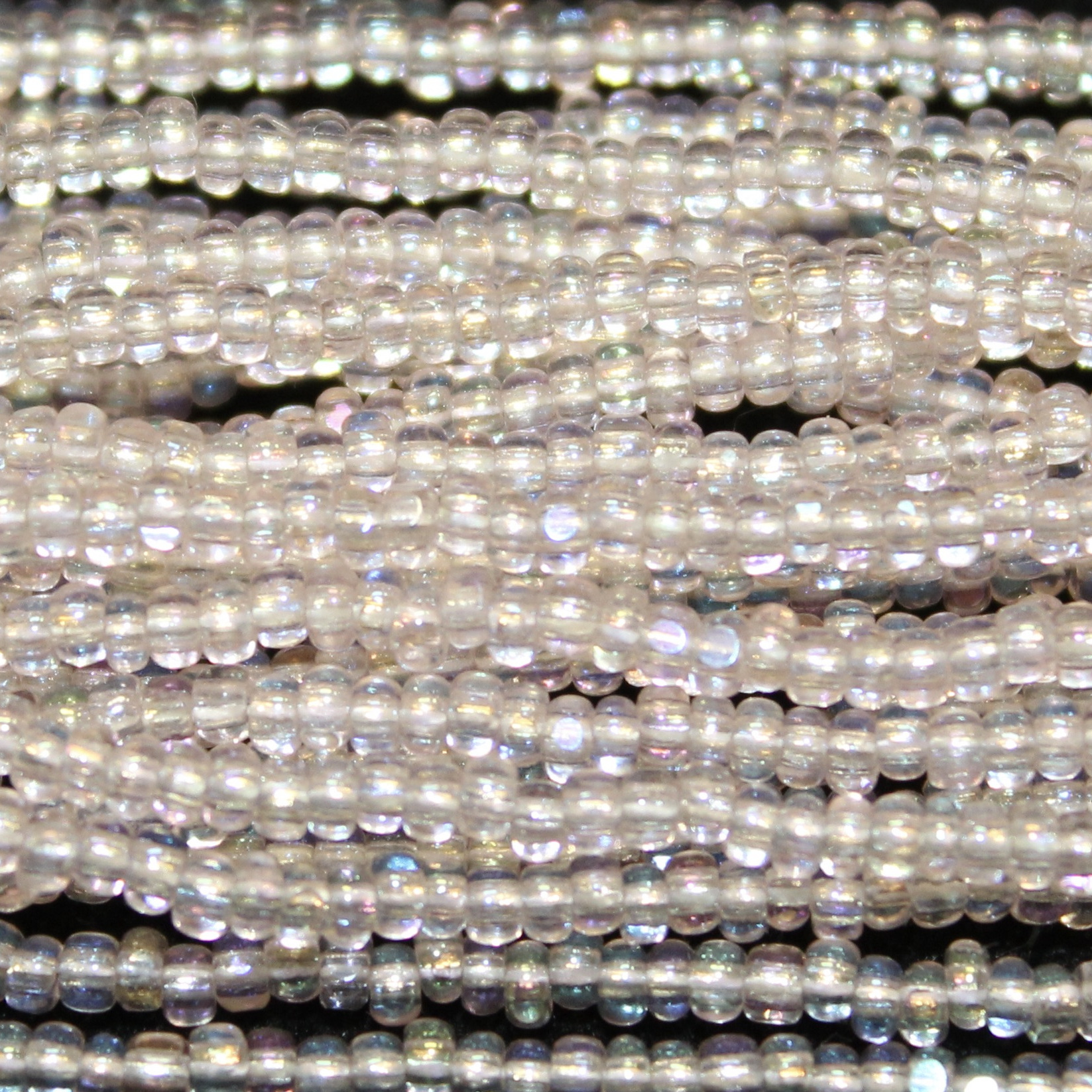 Charlotte Cut Transparent Pale Rose AB Glass seed beads