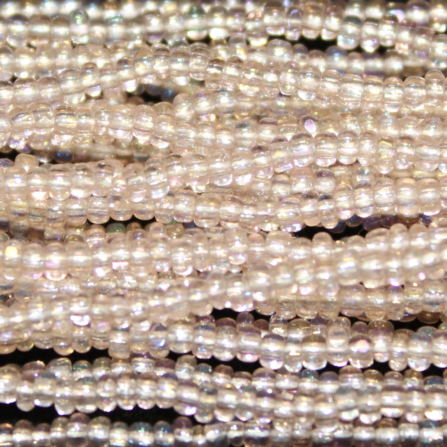 Charlotte Cut Transparent Light Rose AB Glass seed beads